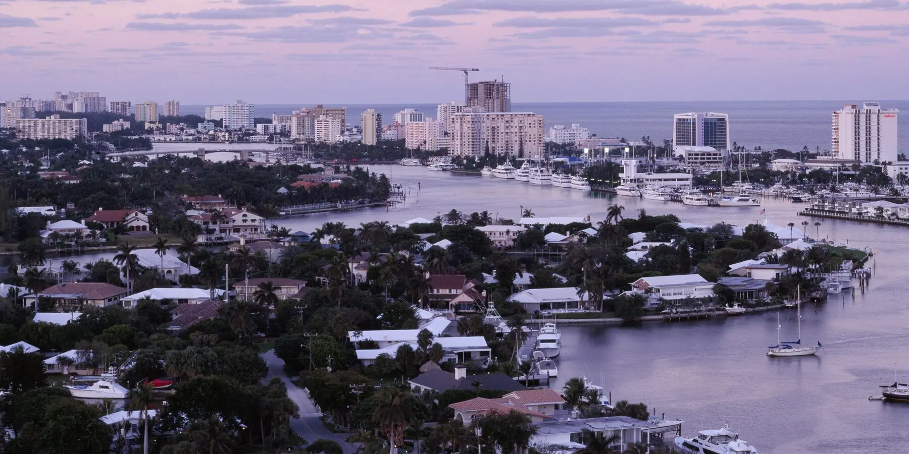 Fort Lauderdale at dusk — the canals that give the county its shape.
