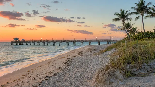 Sunrise over a fishing pier and the Atlantic.