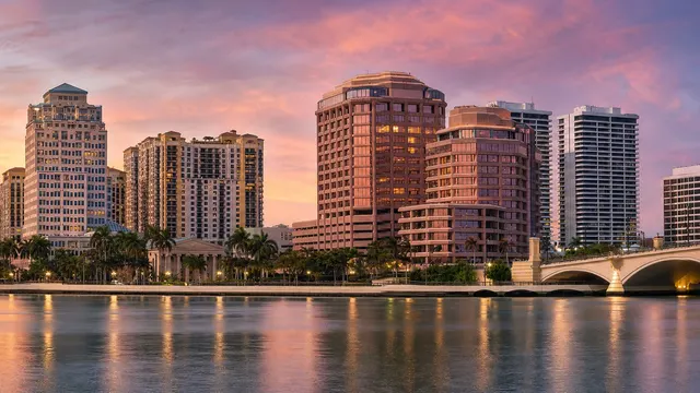 The West Palm Beach skyline across the Intracoastal at sunset.